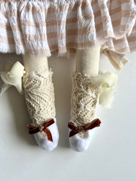 detail of cat stockings and felt shoes.