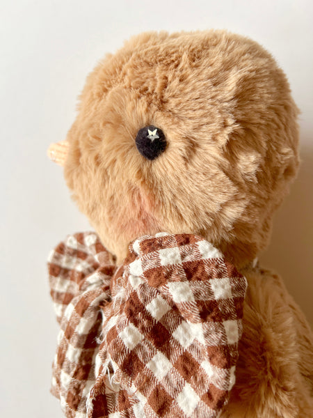 faux fur chick dolls with scarf on a light background