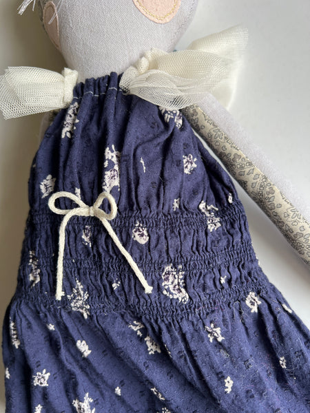 blue and white floral dress on cat doll.