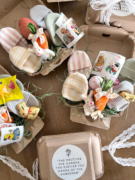 Easter-themed decorations including bunnies, eggs, and a sign on a wooden surface.