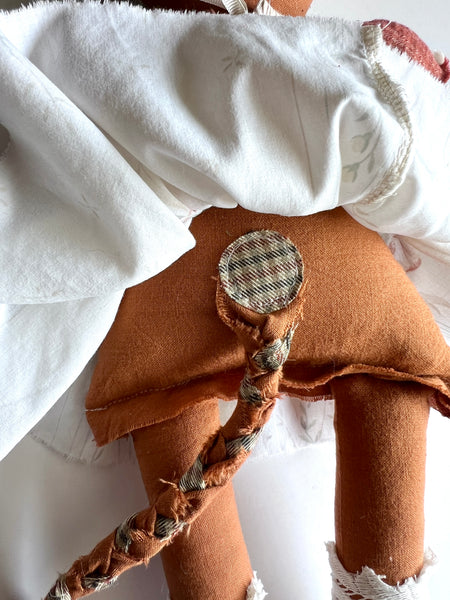 back detail of cat doll.