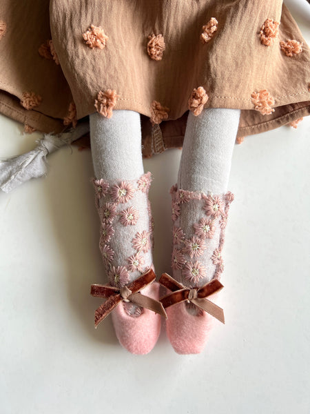 Leg detail of the doll.